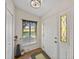 Bright entryway featuring a white door with decorative glass and a view of the golf course at 2680 Clubhouse Dr, Lake Wales, FL 33898