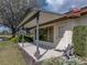 Inviting covered front porch entrance, featuring a well maintained door and beautiful, low maintenance landscaping at 2680 Clubhouse Dr, Lake Wales, FL 33898