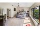 Well-lit main bedroom with a ceiling fan, a garden view, and neutral tones at 2680 Clubhouse Dr, Lake Wales, FL 33898