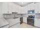 Modern kitchen featuring gray countertops and white cabinetry at 3020 Caneel St, Winter Haven, FL 33884