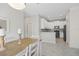 Modern kitchen with white cabinets, gray countertops, and stainless steel appliances at 3020 Caneel St, Winter Haven, FL 33884