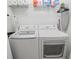 Bright laundry room with LG washer and dryer, plus ample shelving at 3020 Caneel St, Winter Haven, FL 33884