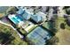 Aerial view of community pool, tennis and pickleball courts, providing various recreational options at 3020 Caneel St, Winter Haven, FL 33884