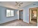 Bright bedroom featuring a window, closet, and ceiling fan at 337 Swingle St, Frostproof, FL 33843