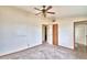 Spacious bedroom with ceiling fan and access to bathroom at 337 Swingle St, Frostproof, FL 33843