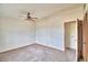 Bright bedroom with ceiling fan and neutral walls at 337 Swingle St, Frostproof, FL 33843