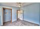 Cozy bedroom with ceiling fan, closet, and neutral walls at 337 Swingle St, Frostproof, FL 33843