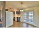 Kitchen dining area with access to backyard patio at 337 Swingle St, Frostproof, FL 33843