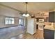 Kitchen with microwave, stove, refrigerator and light wood floors at 337 Swingle St, Frostproof, FL 33843