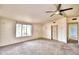 Bright living room featuring a large window and ceiling fan at 337 Swingle St, Frostproof, FL 33843