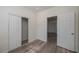 Well-lit bedroom with wood-look floors and a spacious closet at 412 2Nd Sw St, Winter Haven, FL 33880