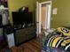 Bedroom with dresser and large TV at 4718 Cynthia St, Bartow, FL 33830