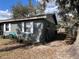 Gray house exterior with white shutters at 4718 Cynthia St, Bartow, FL 33830