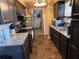 Kitchen with dark cabinets and granite countertops at 4718 Cynthia St, Bartow, FL 33830