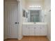 Bathroom featuring a vanity with ample cabinet space and a large mirror at 5011 Hemingway Cir # 5011, Haines City, FL 33844