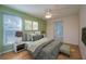 Inviting bedroom featuring natural light, a ceiling fan, and neutral decor at 5011 Hemingway Cir # 5011, Haines City, FL 33844