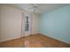 Bright bedroom with tile flooring, a ceiling fan, and a large window at 5011 Hemingway Cir # 5011, Haines City, FL 33844