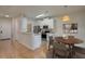 Cozy eat-in kitchen with stainless steel appliances, white cabinetry, and a dining table at 5011 Hemingway Cir # 5011, Haines City, FL 33844