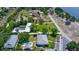 Aerial view of a beautiful lakeside community with mature landscaping, a community pool, and ample parking at 711 Springer Dr # 2, Lake Wales, FL 33853
