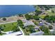 Great aerial showcasing prime location near lake, community pool, well-manicured lawns, and mature trees at 711 Springer Dr # 2, Lake Wales, FL 33853