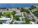Property with lake access, pool, lush landscaping, and ample parking for residents and guests at 711 Springer Dr # 2, Lake Wales, FL 33853