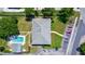 Aerial view of the property showing mature landscaping, swimming pool, and ample parking at 711 Springer Dr # 2, Lake Wales, FL 33853