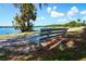 Bench near the walking trail next to a beautiful lake with blue skies overhead at 711 Springer Dr # 2, Lake Wales, FL 33853