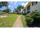 The building features a well manicured lawn with a sidewalk leading up to the entrance at 711 Springer Dr # 2, Lake Wales, FL 33853