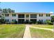 Charming two-story building with well-maintained landscaping and inviting curb appeal at 711 Springer Dr # 2, Lake Wales, FL 33853