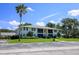 Well-maintained two-story condo building with parking and lush landscaping at 711 Springer Dr # 2, Lake Wales, FL 33853