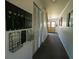 Common hallway with mailboxes, storage, and an exit door at 711 Springer Dr # 2, Lake Wales, FL 33853