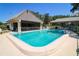 Sparkling community pool with pool house and lounge chairs at 711 Springer Dr # 2, Lake Wales, FL 33853