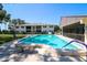 The property has a sparkling pool with a bench and a well maintained deck area at 711 Springer Dr # 2, Lake Wales, FL 33853