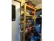 Indoor storage with wooden shelving for various tools, equipment, and household items at 1402 Thousand Roses Dr. W. # 1402, Lake Wales, FL 33853