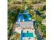 Aerial view of property, showcasing the pool, patio, and access to the lake at 1800 N Scenic Hwy, Babson Park, FL 33827