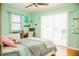 Cozy bedroom featuring a bed, desk, and ample natural light creating a welcoming and functional space at 1800 N Scenic Hwy, Babson Park, FL 33827