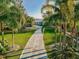 Beautiful front yard with mature palm trees and an extended driveway leading to the home at 1800 N Scenic Hwy, Babson Park, FL 33827