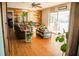 Relaxing living room with rustic wood accent wall, comfortable seating, and sliding glass doors at 1800 N Scenic Hwy, Babson Park, FL 33827