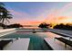 Poolside sunset with picturesque sky views overlooking the calm lake at 1800 N Scenic Hwy, Babson Park, FL 33827