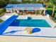 Outdoor in-ground swimming pool surrounded by a patio, seating, and bar area at 1800 N Scenic Hwy, Babson Park, FL 33827