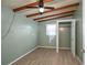 Bedroom with a ceiling fan, closet, window, and light-colored vinyl wood plank flooring at 1831 Richmond Rd, Lakeland, FL 33803