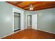 Bedroom with hardwood flooring, closet, and access to connecting rooms at 1831 Richmond Rd, Lakeland, FL 33803