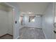 This bedroom features tile flooring, bright window, and neutral paint at 1831 Richmond Rd, Lakeland, FL 33803