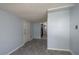 Hallway with vinyl floors features an entrance to an adjacent room and a closet at 1831 Richmond Rd, Lakeland, FL 33803