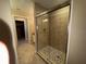 Bathroom featuring a glass-enclosed shower with stone flooring at 1893 N Lake Reedy Blvd, Frostproof, FL 33843