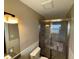 This is a tiled bathroom with a glass enclosed shower and a clean toilet at 1893 N Lake Reedy Blvd, Frostproof, FL 33843