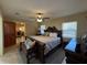 Spacious main bedroom with hardwood furnishings and natural light at 1893 N Lake Reedy Blvd, Frostproof, FL 33843