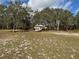 Secluded home surrounded by trees and landscaping at 2134 R E Byrd Rd, Frostproof, FL 33843