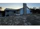 Exterior view of a home with a stone chimney and siding at 2134 R E Byrd Rd, Frostproof, FL 33843