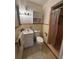 Standard bathroom with tile shower and toilet and sink combination at 2263 Lake Reedy N Blvd, Frostproof, FL 33843